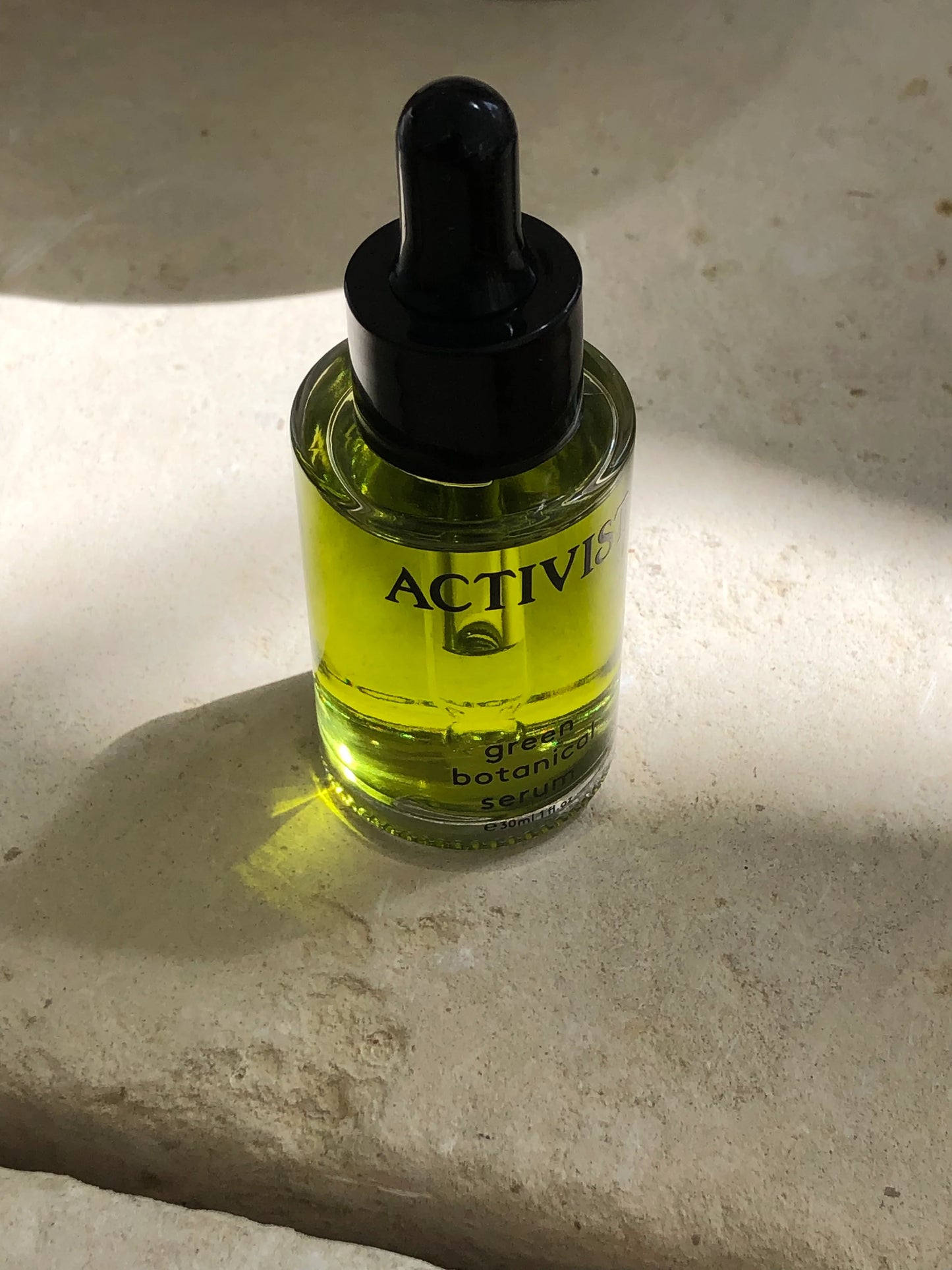 Green Botanical Serum from ACTIVIST bottle