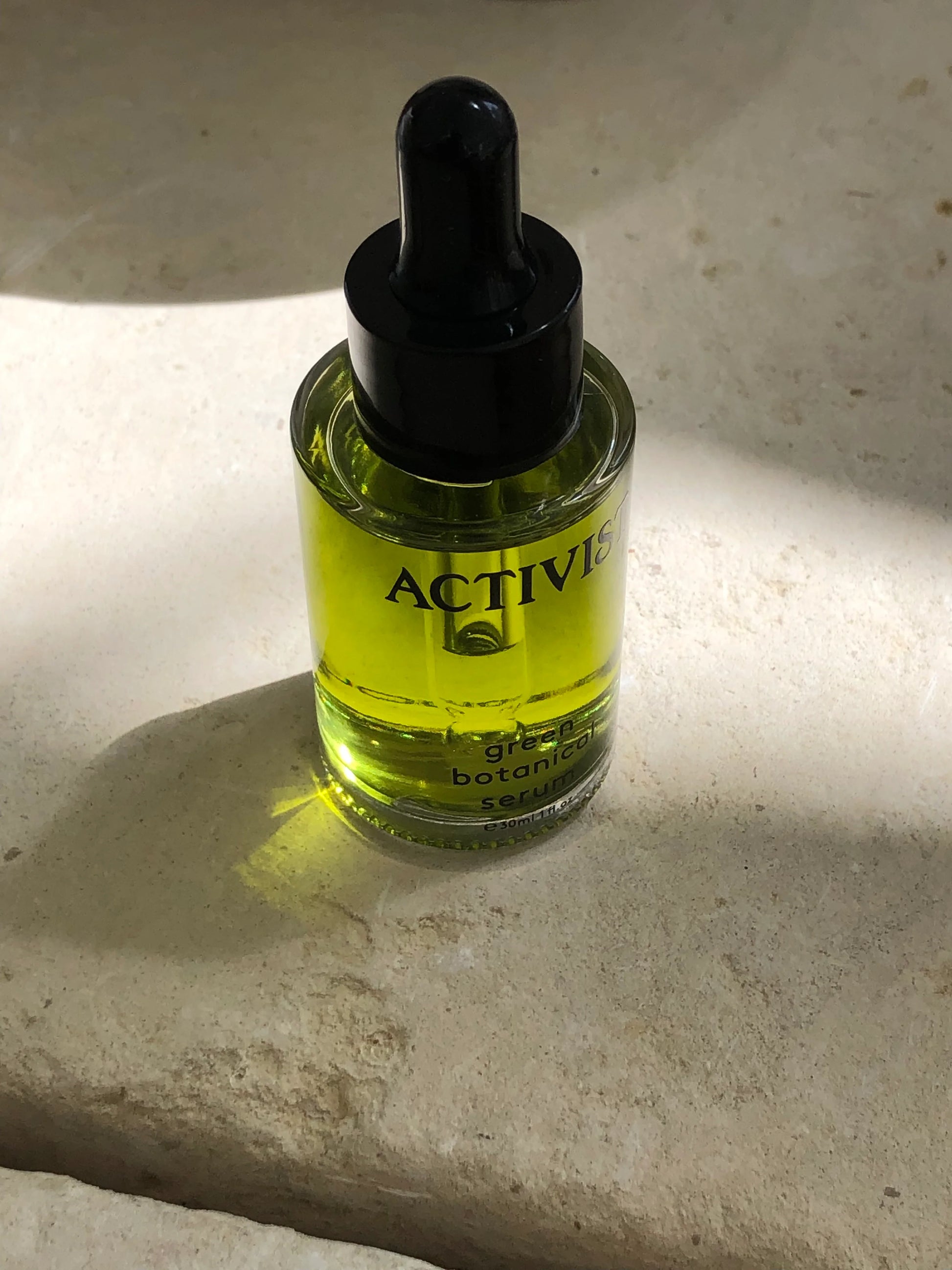 Green Botanical Serum from ACTIVIST bottle