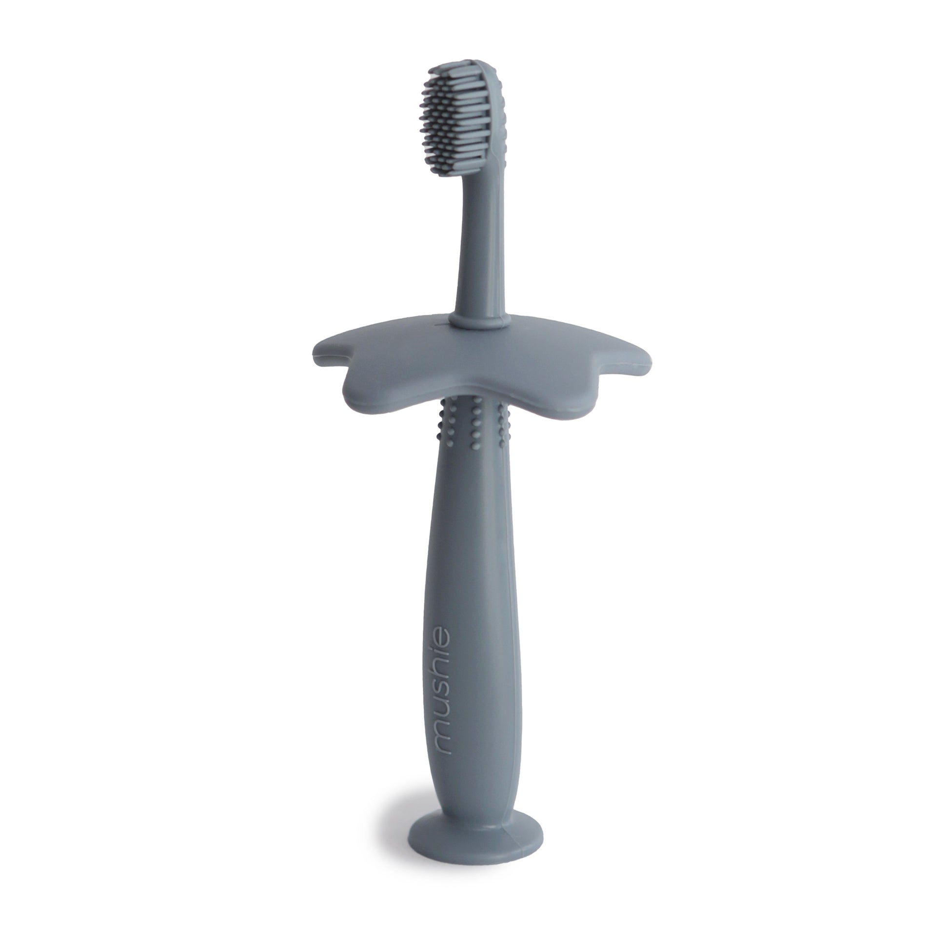Star training toothbrush from mushie in tradewinds color