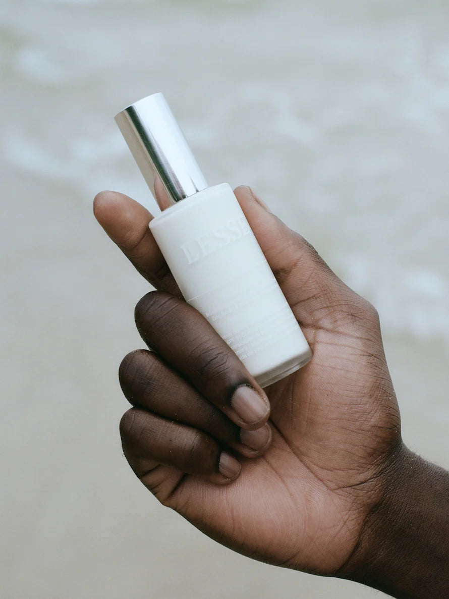 Every Tone SPF Sunscreen from LESSE, man holding bottle in his hand