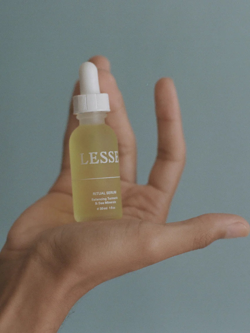 Ritual Serum from LESSE, bottle hold in hand