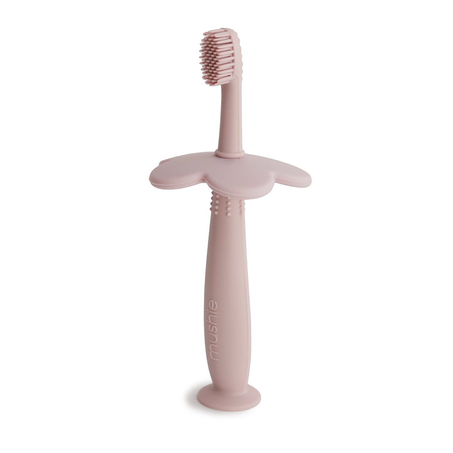 Flower training toothbrush from Mushie in color blush