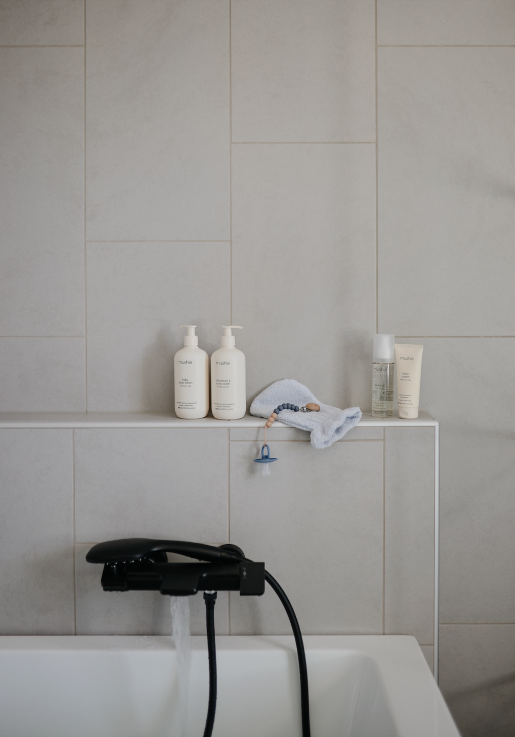 Skincare products fragrance free from Mushie,  in a bathroom