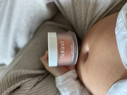 Love Lines from SoKind, a stretch mark balm, product and a pregnant belly